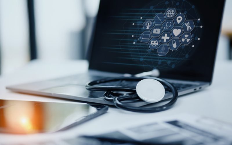 Doctor stethoscope with laptop on desk, Healthcare and medical service concept.