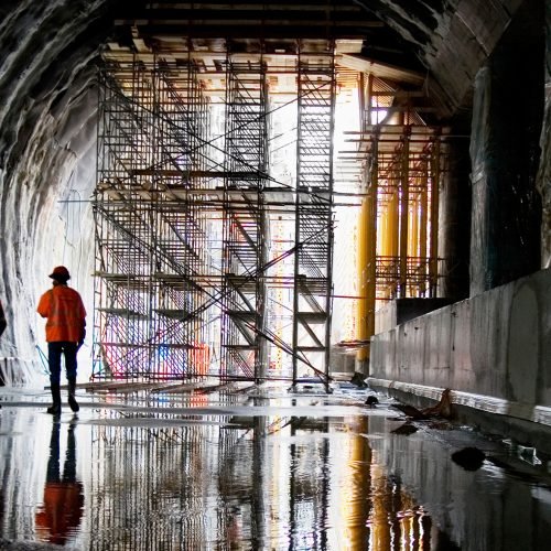 Rear view of workers at construction site