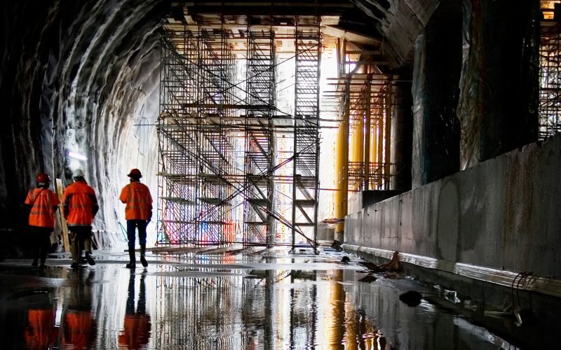 Rear view of workers at construction site