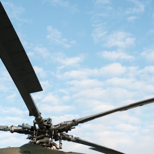 Helicopter rotor on bright sunny day with blue skies